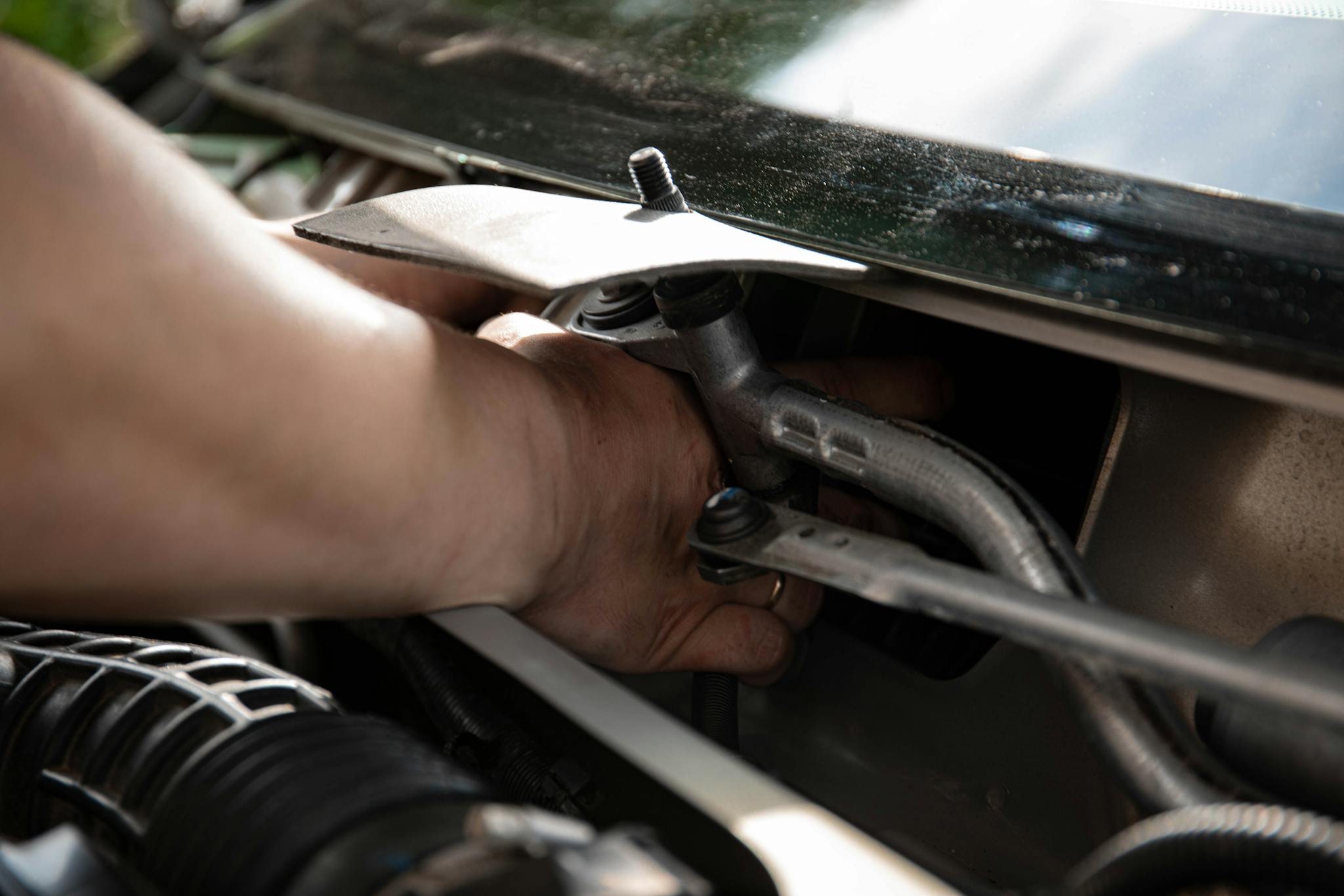 Person Fixing a Car